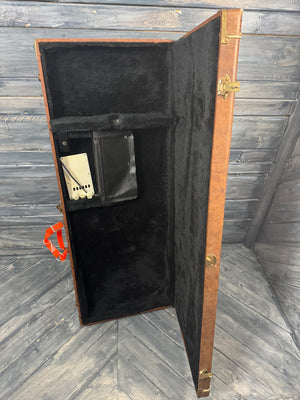 Wooden briefcase with black interior on a wooden floor