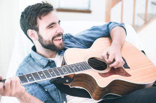 learning to play a guitar