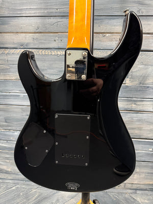 Black electric guitar on a wooden floor