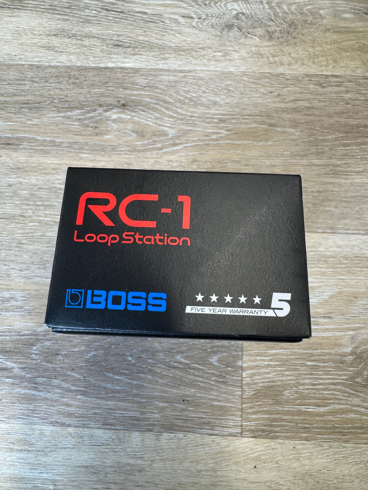 Boss RC-1 Loop Station on a wooden surface