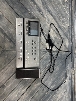 Electronic device with a power cable on a wooden surface