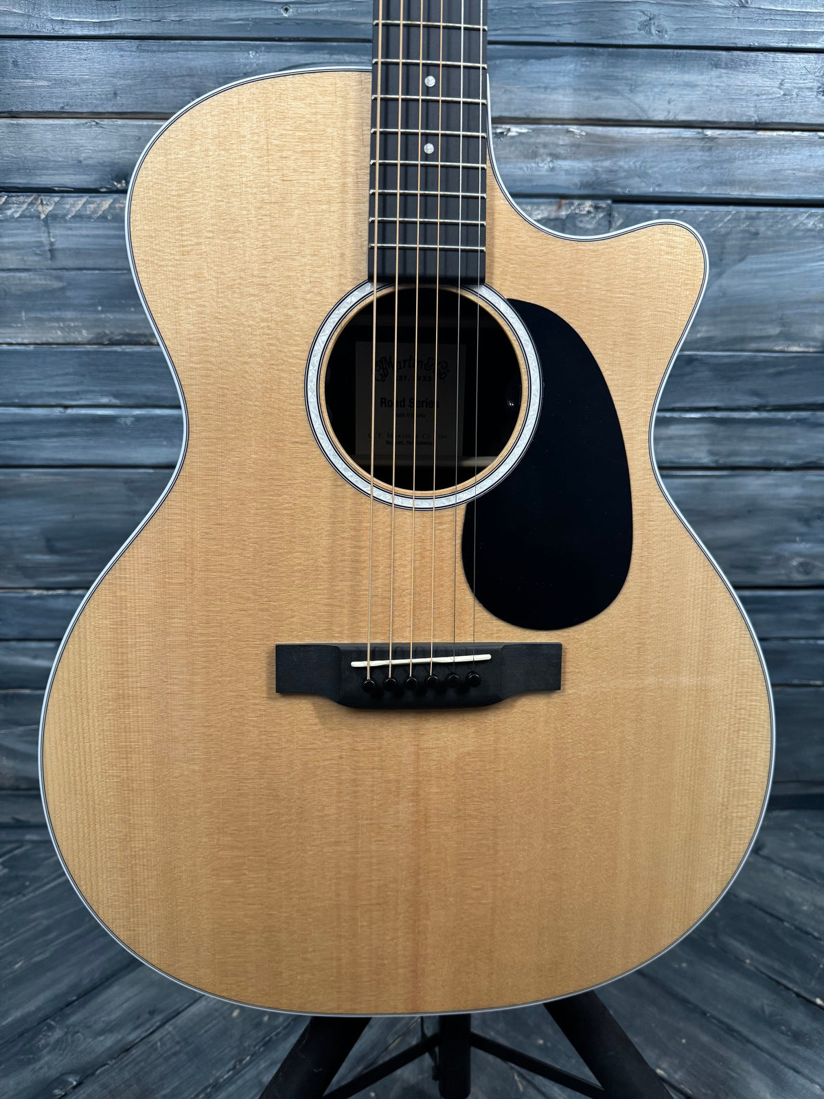Acoustic guitar on a wooden surface