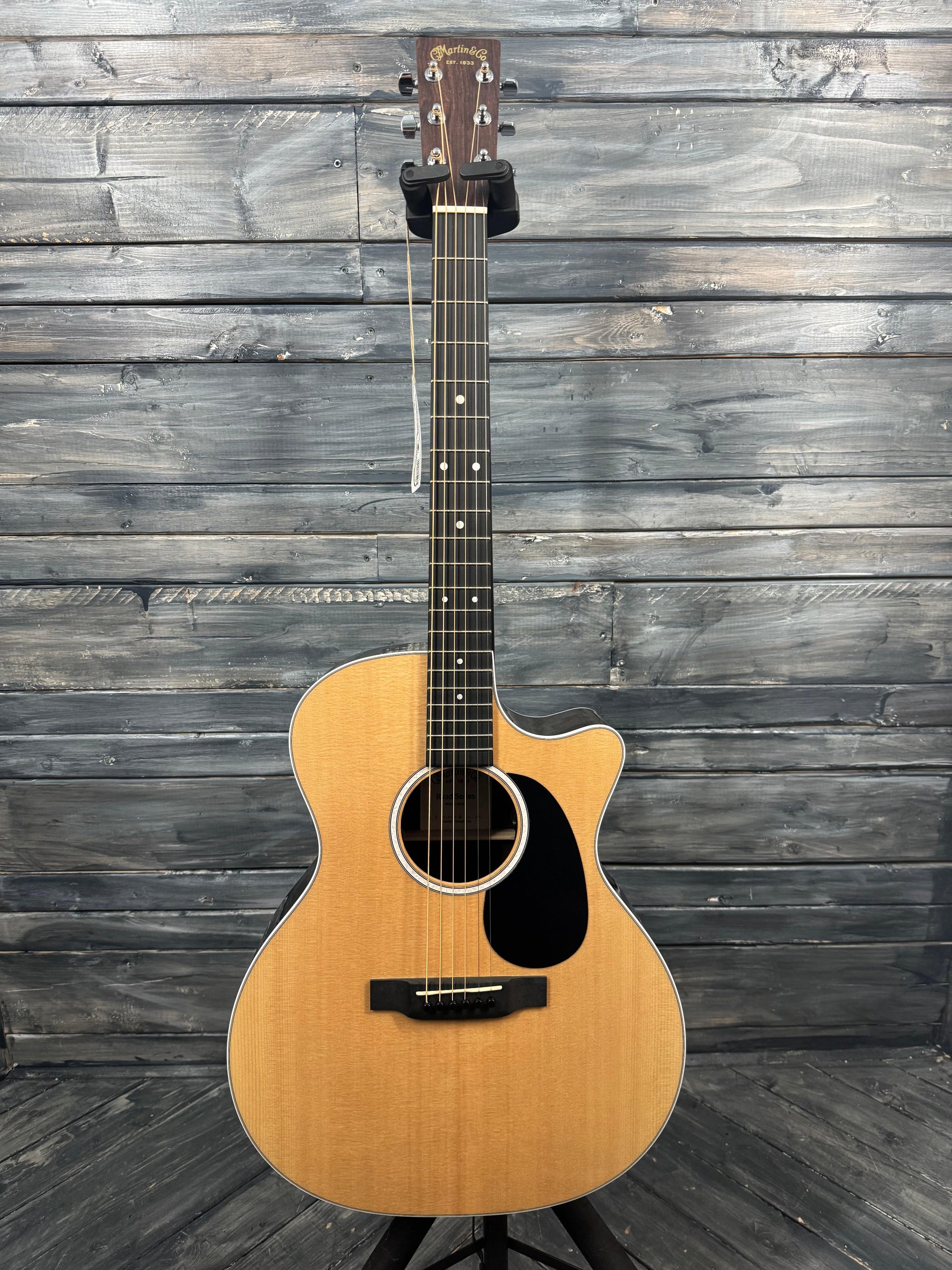 Acoustic guitar on a wooden surface