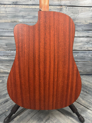 Wooden guitar body on a wooden surface