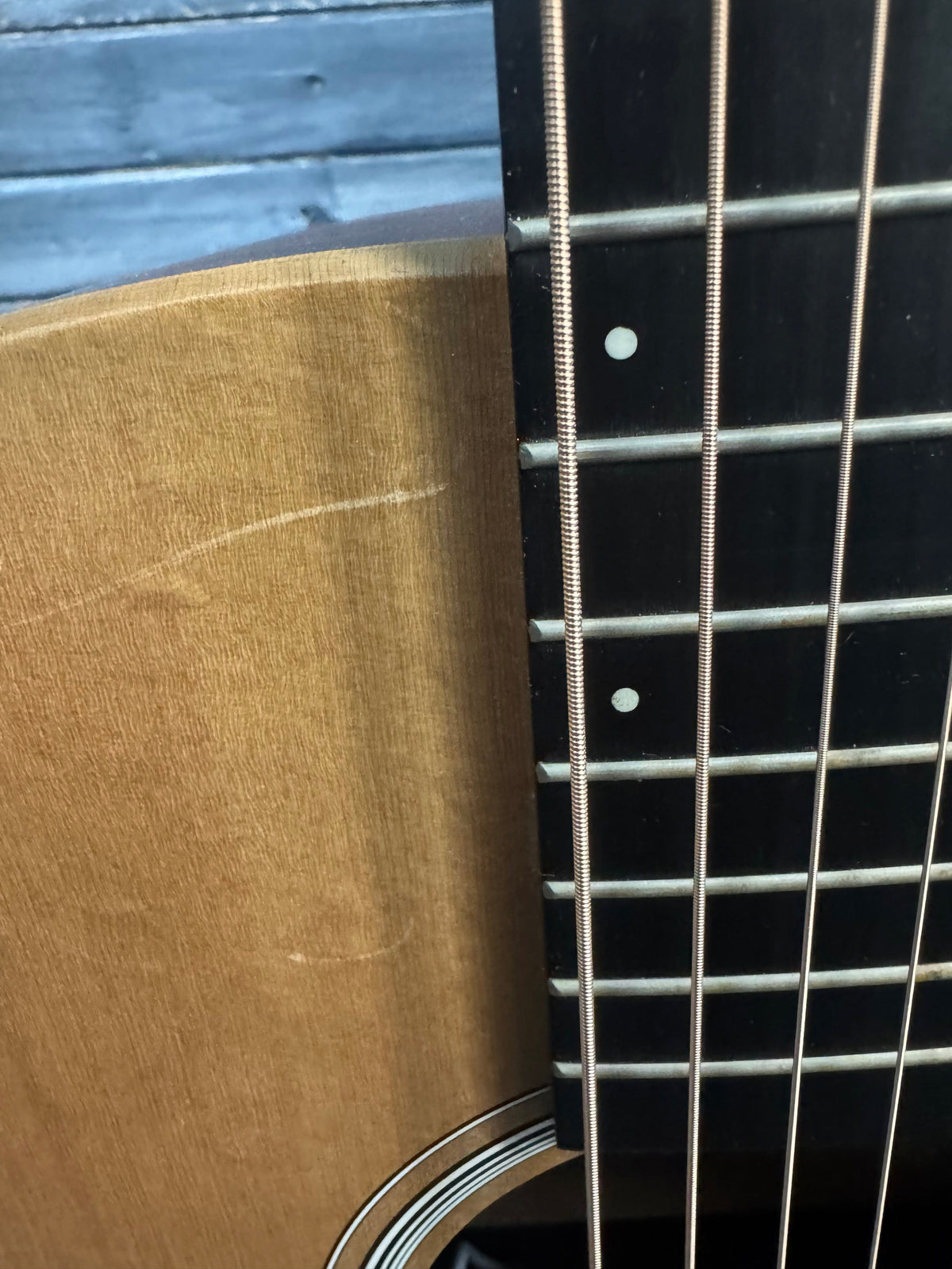 Close-up of a guitar's soundhole and strings