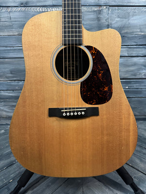 Acoustic guitar on a wooden surface