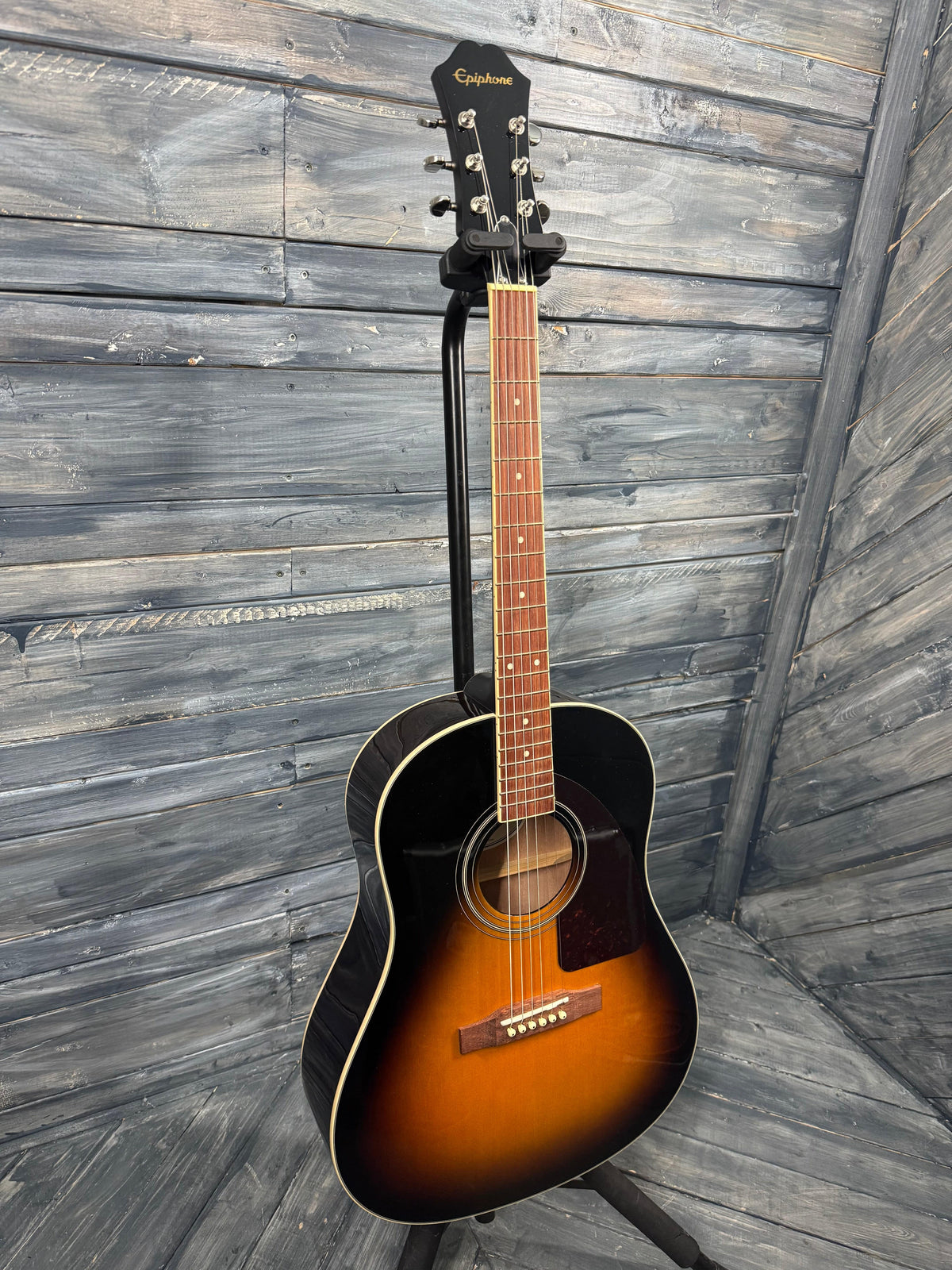 Acoustic guitar on a wooden floor