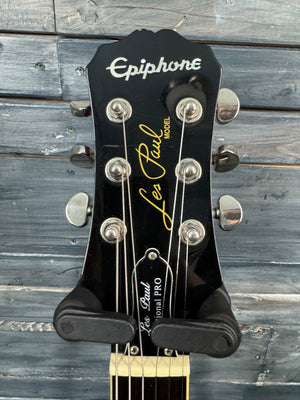 Epiphone Les Paul guitar headstock on a wooden background