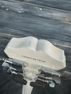 Close-up of a tool holder with multiple drill bits against a wooden background