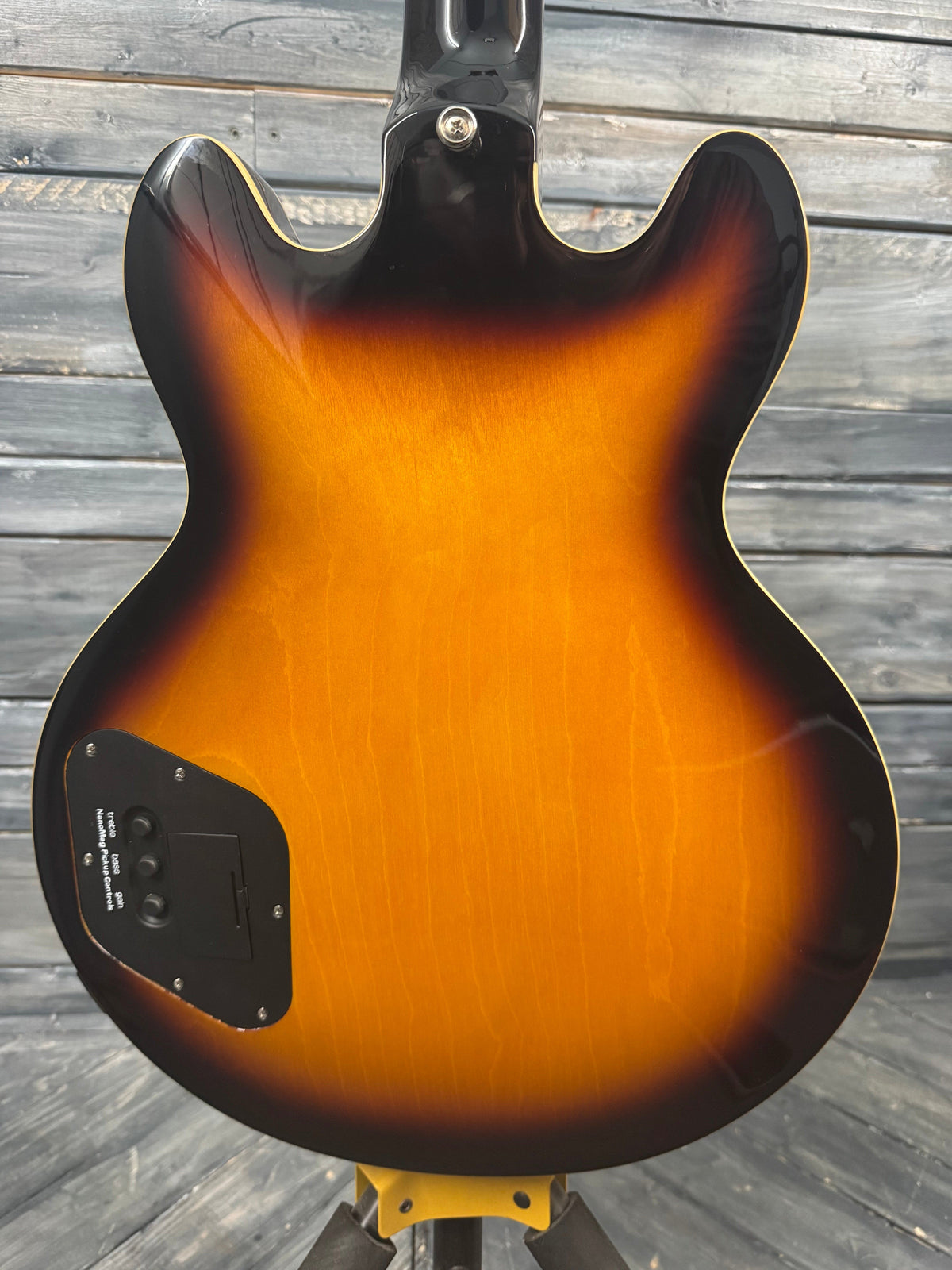 Guitar body with sunburst finish on a wooden surface