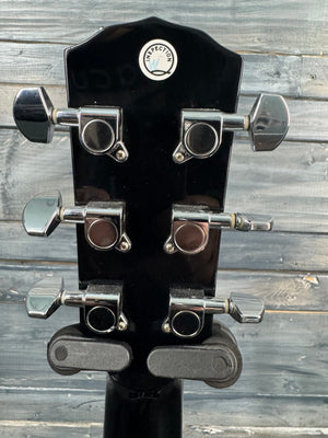 Guitar headstock with tuning pegs against a wooden background