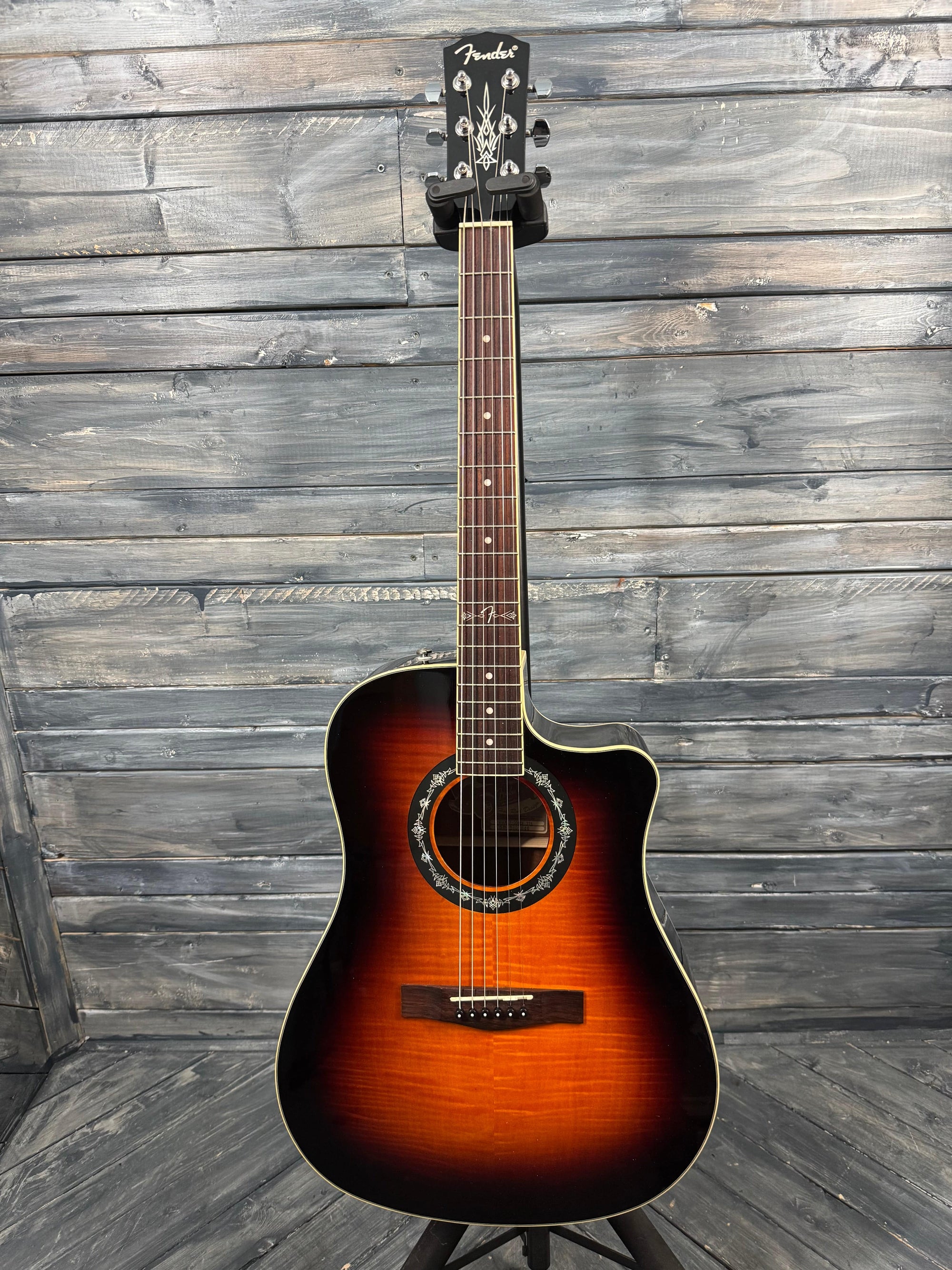 Acoustic guitar on a wooden surface