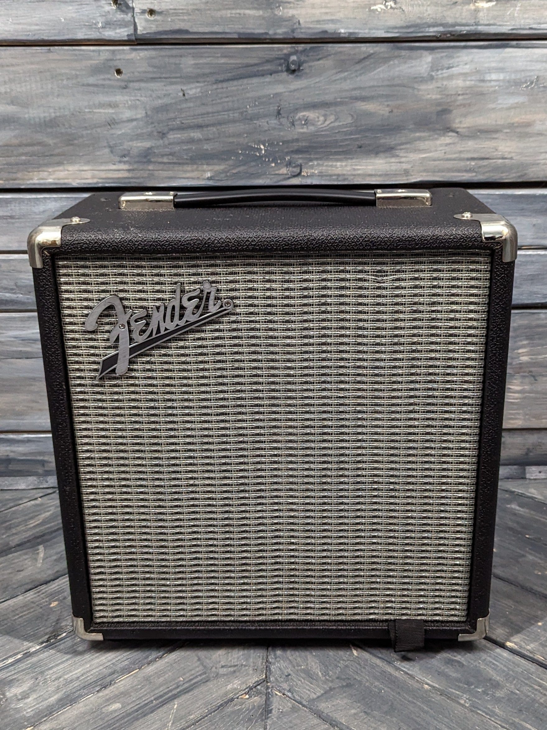 Used Fender Rumble 15 front of the amp