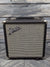 Used Fender Rumble 15 front of the amp