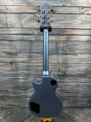 Blue electric guitar on a wooden surface