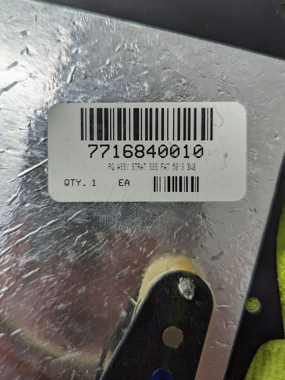 Used Fender 1979 Stratocaster label on the back of the pickguard