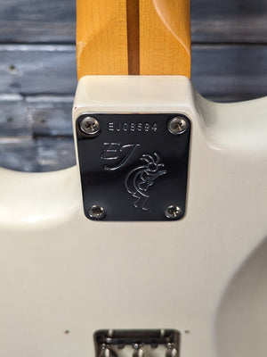 Used Fender Eric Johnson Stratocaster close up of the neck plate