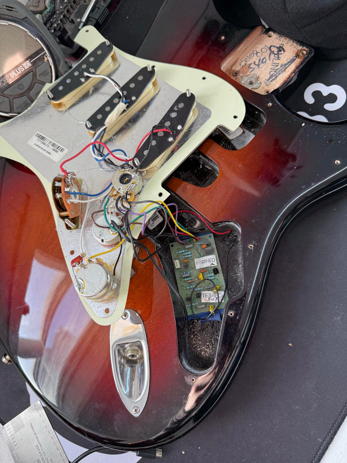 Used Fender 2016 American Professional Strat view of the installed active mid boost and the electronics