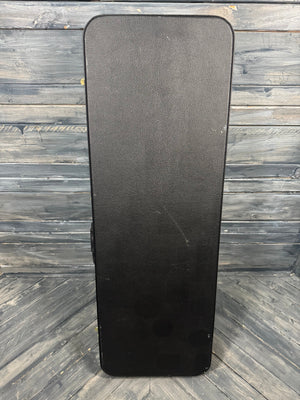 Black guitar case on a wooden floor