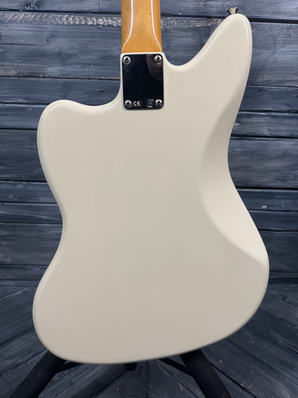 White electric guitar body on a wooden surface