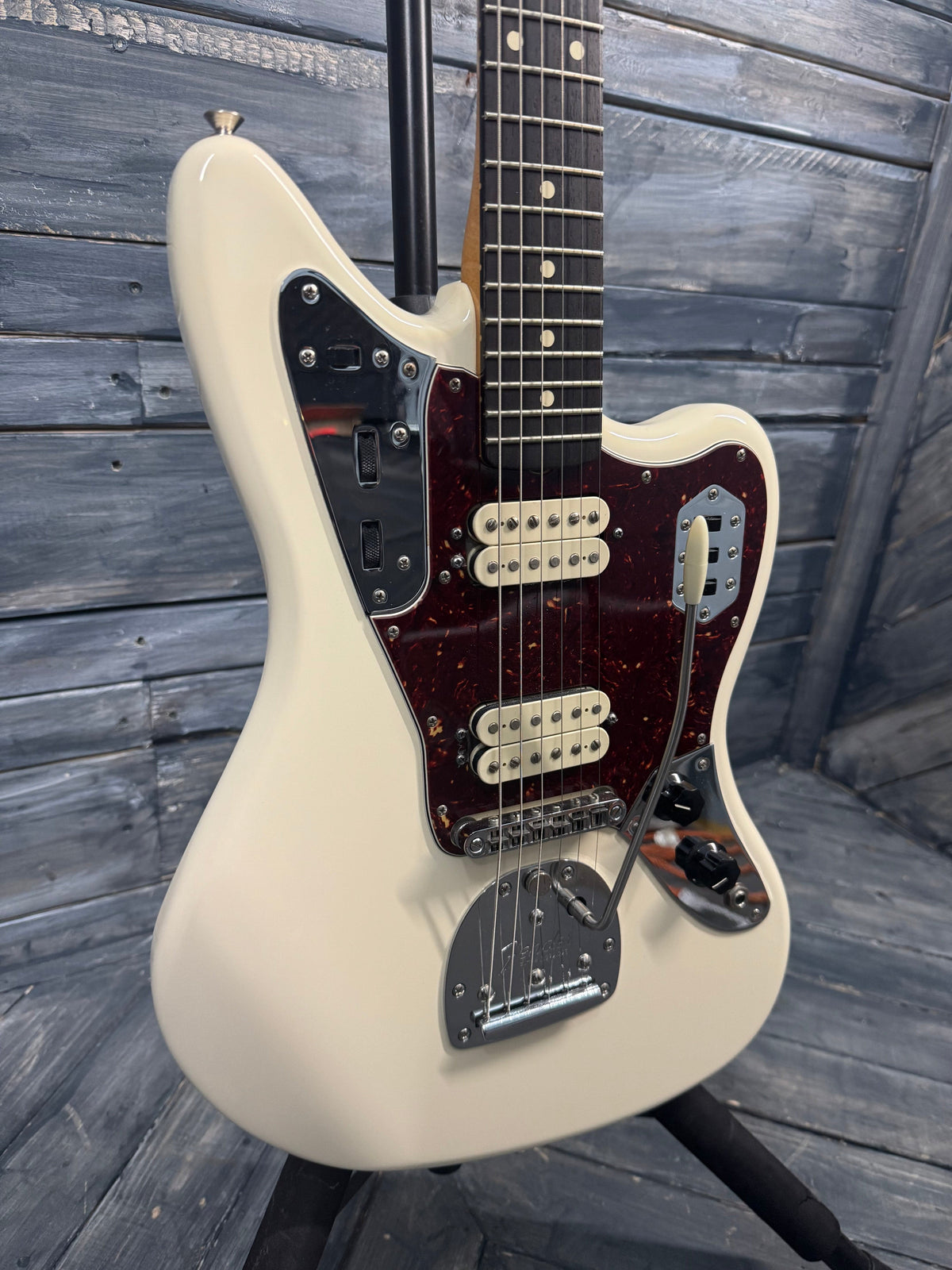 White electric guitar on a wooden surface