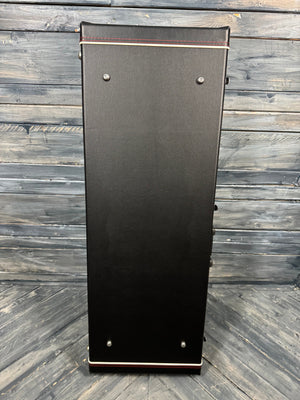 Black rectangular object with metallic edges on a wooden surface