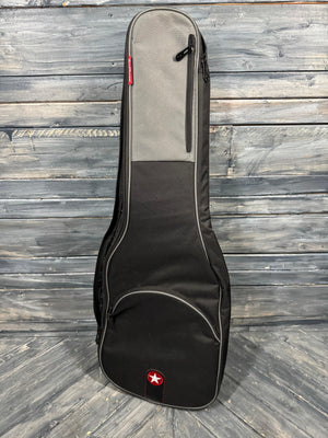 Guitar case on a wooden floor with a brand logo.