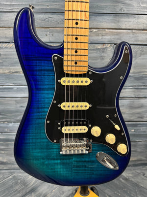 Blue electric guitar on a wooden background
