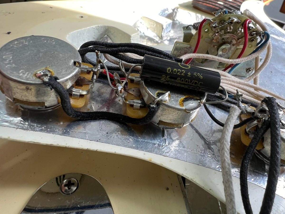 Used Fender Stratocaster close up of the pots