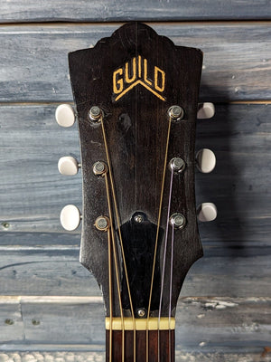 Used Guild D-25 front of the headstock