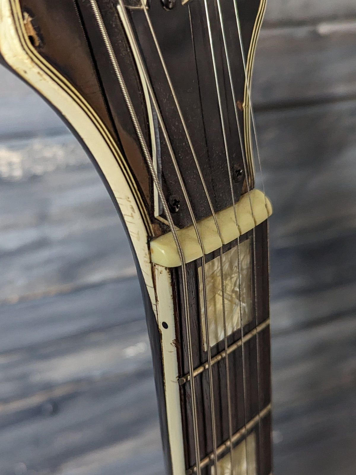 Used Hohner finish cracks near headstock