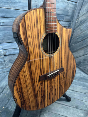 Wooden acoustic guitar on a wooden floor