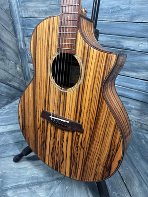 Wooden acoustic guitar on a wooden floor