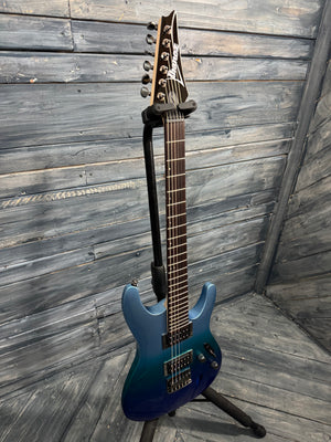 Blue electric guitar on a stand against a wooden wall