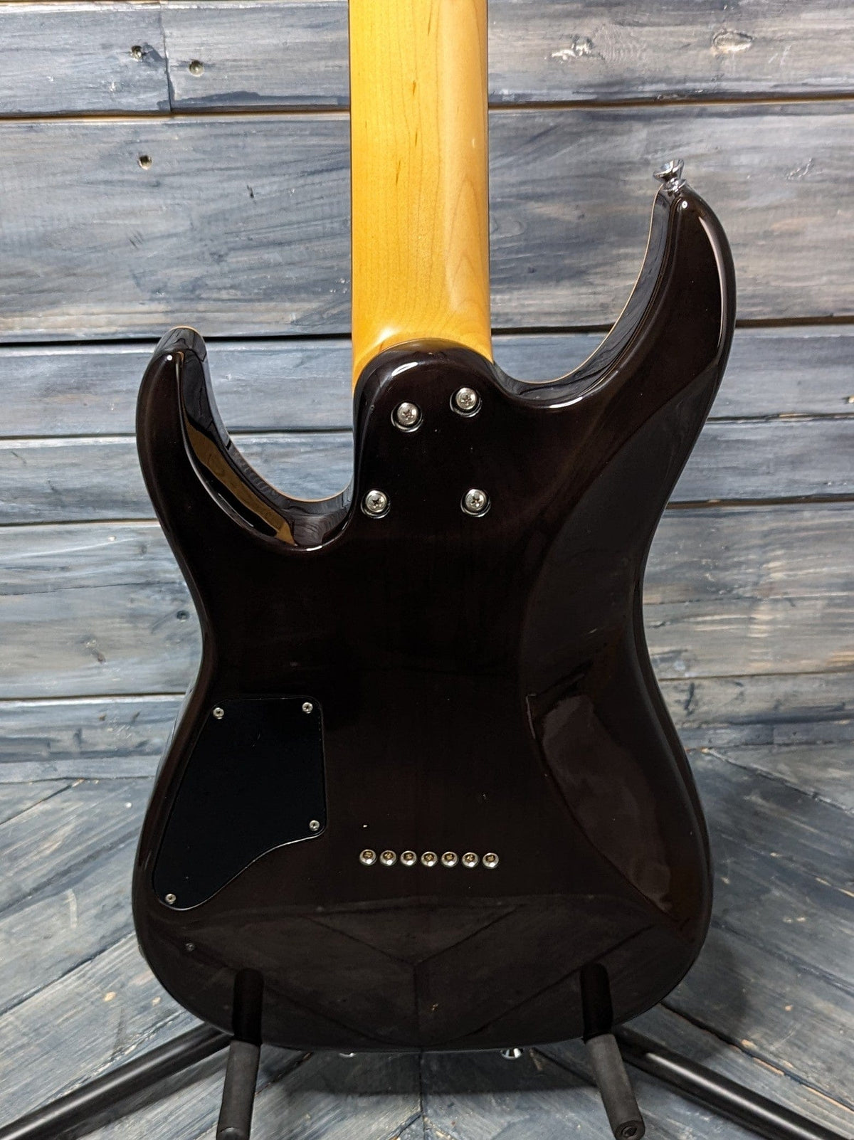 Used Schecter 7-String close up view of the back of the body