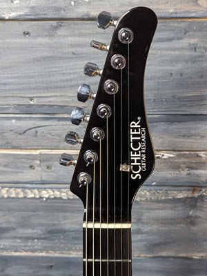Used Schecter 7-String front of the headstock
