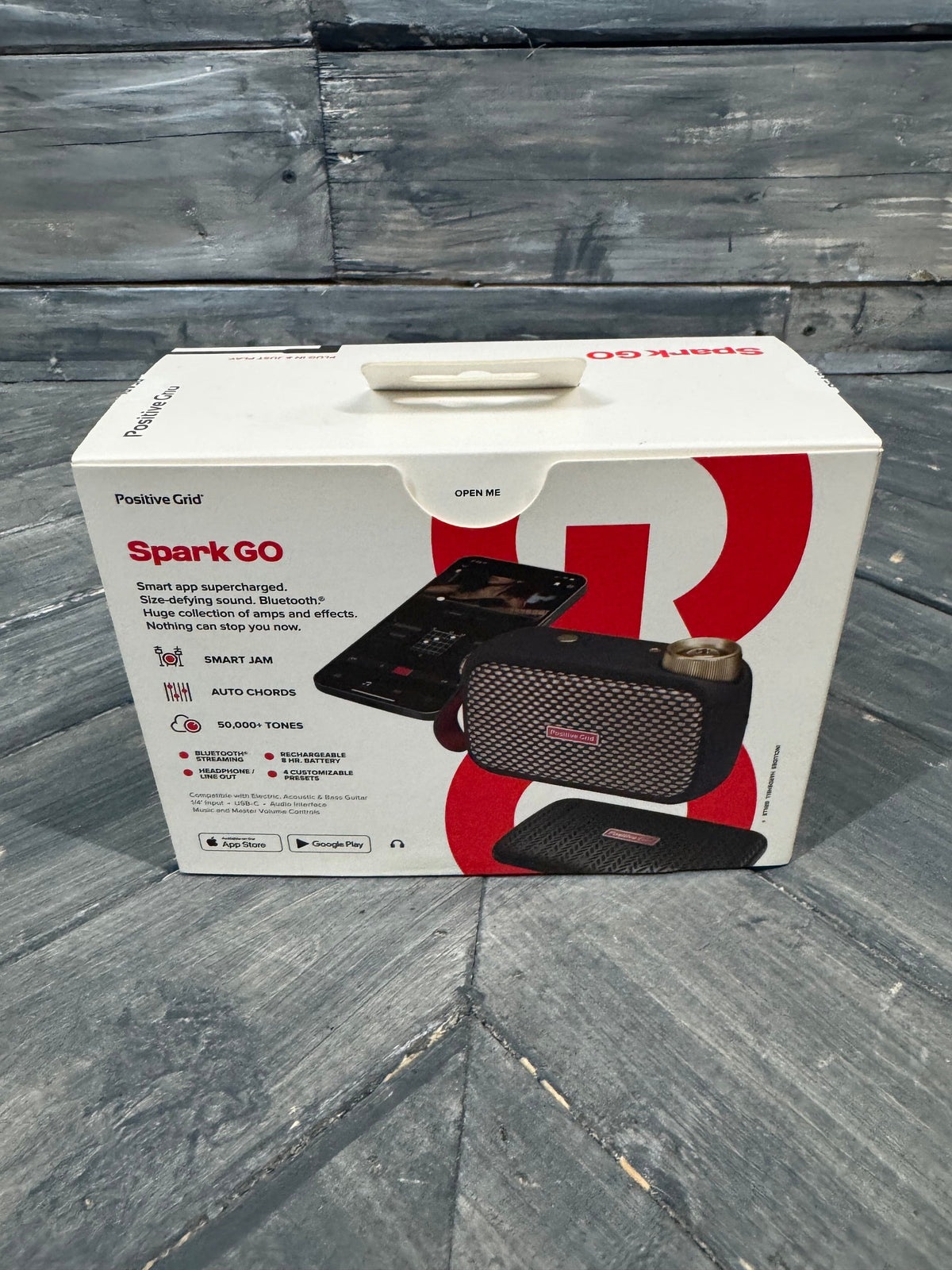 Box of a product named 'Spark GO' on a wooden surface