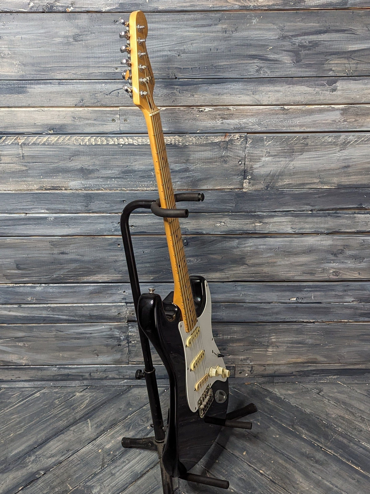 Used Squier Stratocaster full bass side view of the guitar