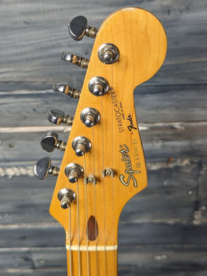 Used Squier Stratocaster front of the headstock