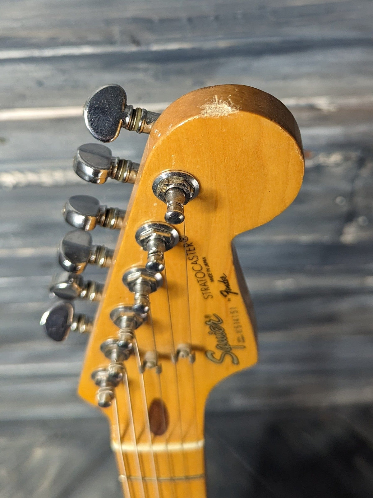 Used Squier Stratocaster small ding in the headstock