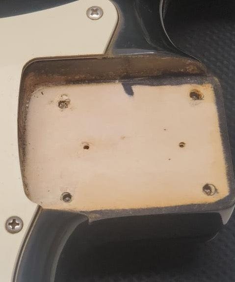 Used Squier close up of the neck pocket